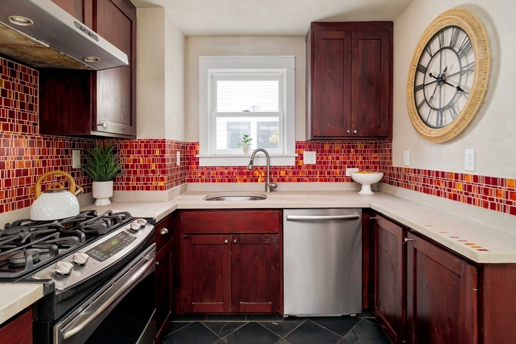 277 Lamartine Street Boston, MA 02130 - Photo 13 of 28 a kitchen with a stove and a sink