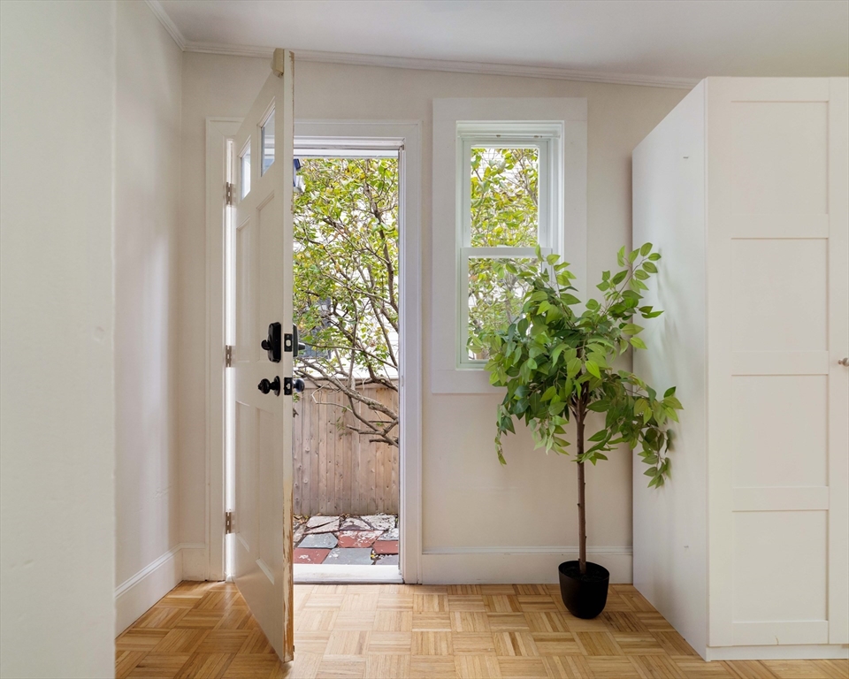 277 Lamartine Street Boston, MA 02130 - Photo 22 of 28 a vase of flowers sitting on a table in a room