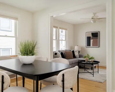 a view of a dining room with furniture and wooden floor