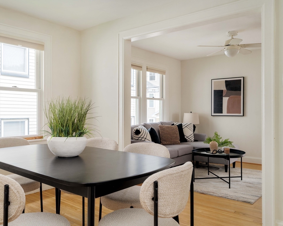 277 Lamartine Street Boston, MA 02130 - Photo 7 of 28 a living room with furniture potted plant and a window