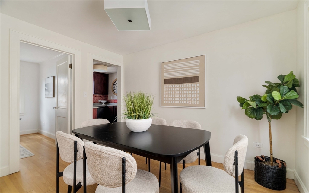 277 Lamartine Street Boston, MA 02130 - Photo 10 of 28 a view of a dining room with furniture and potted plant