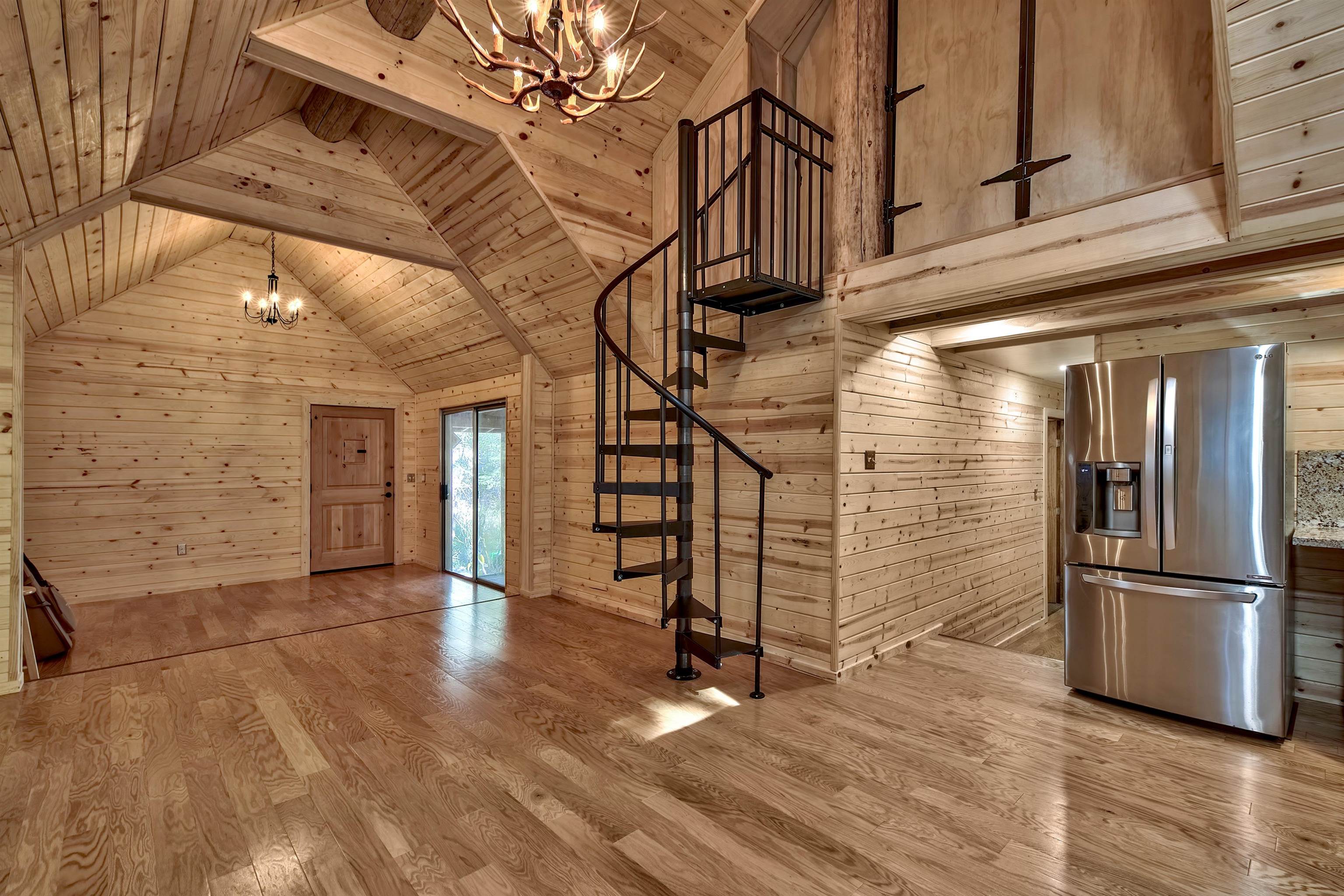 12065 Bums Gulch Road Reno, NV 89511 - Photo 11 of 21 a view of empty room with wooden floor