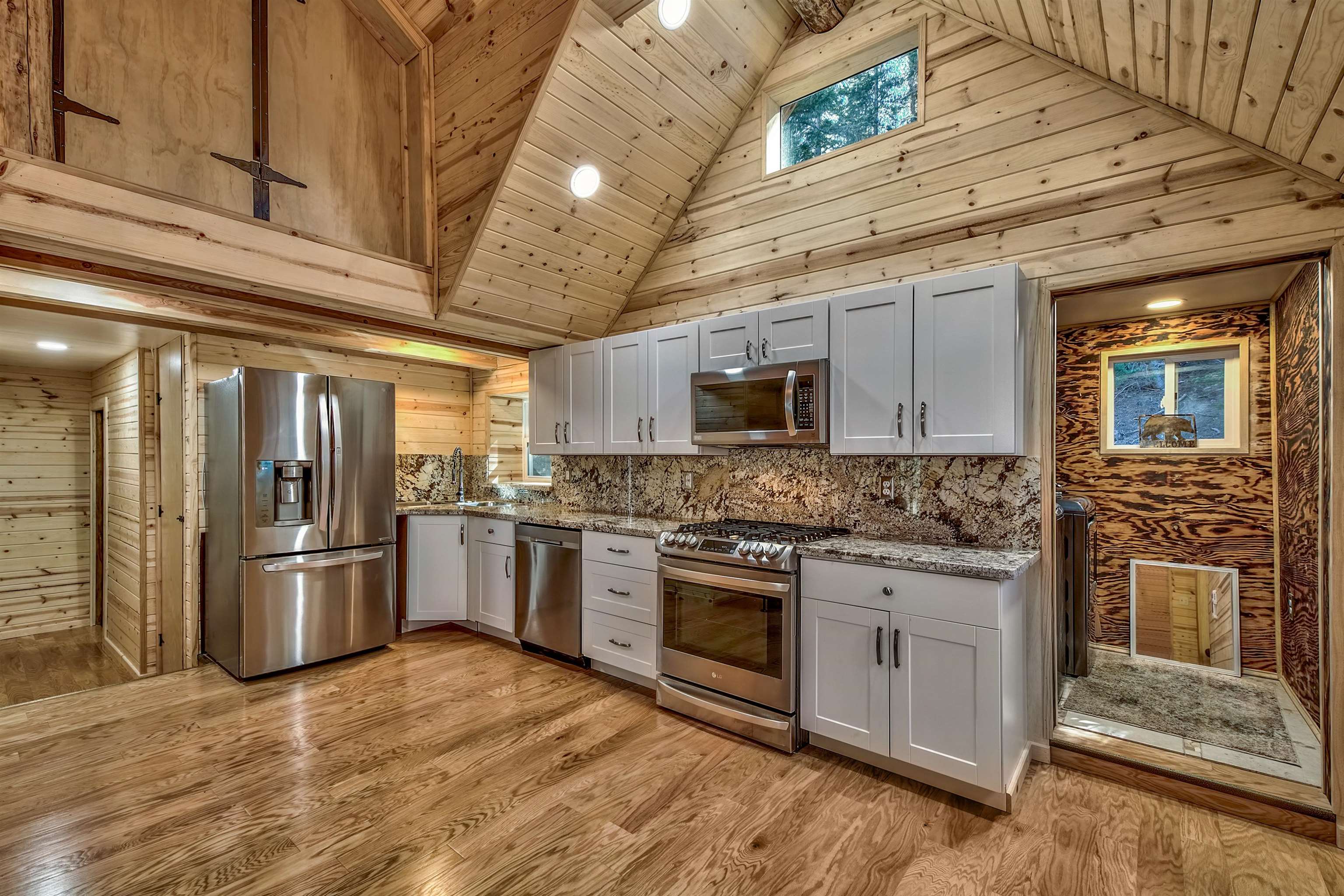 12065 Bums Gulch Road Reno, NV 89511 - Photo 12 of 21 a kitchen with stainless steel appliances granite countertop a stove and a refrigerator
