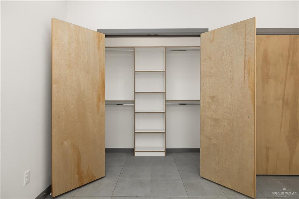 2609 Woodpecker Road, Unit 1 Weslaco, TX 78596 - Photo 11 of 18 a view of walk in closet with empty racks