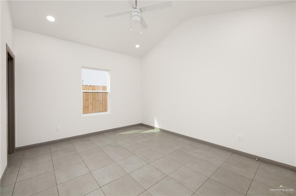 2609 Woodpecker Road, Unit 1 Weslaco, TX 78596 - Photo 12 of 18 an empty room with a empty space and a window