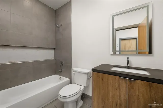 a bathroom with a sink a toilet and a bathtub