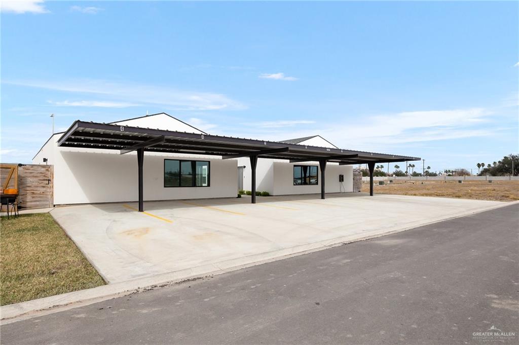 2609 Woodpecker Road, Unit 1 Weslaco, TX 78596 - Photo 14 of 18 a front view of a house with a yard and balcony