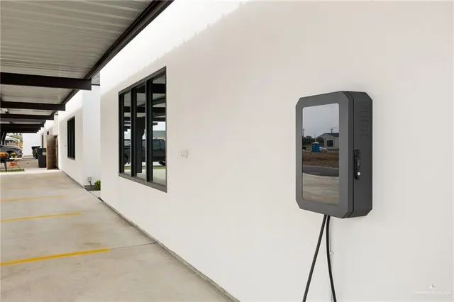 a room with a window and a chandelier