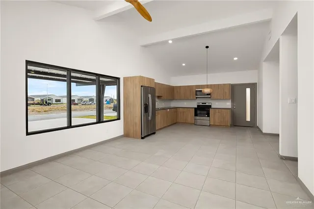 a view of kitchen with furniture and window