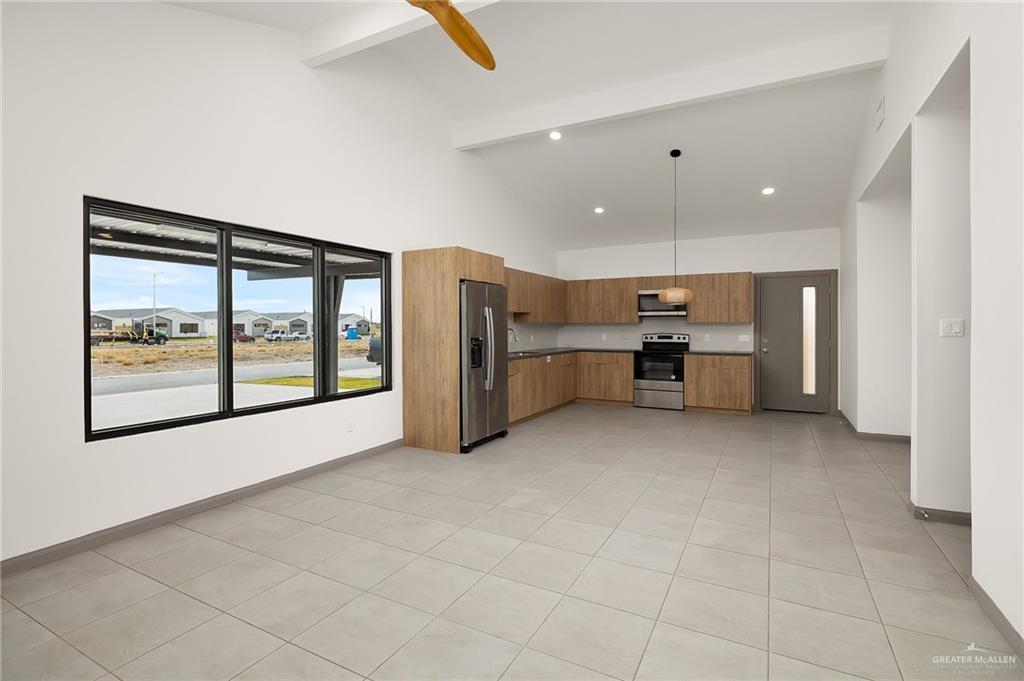 2609 Woodpecker Road, Unit 1 Weslaco, TX 78596 - Photo 6 of 18 a view of kitchen with furniture and window