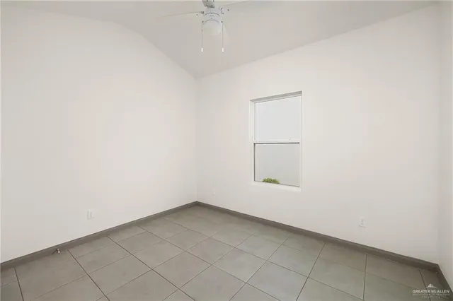 an empty room with a empty space and a window