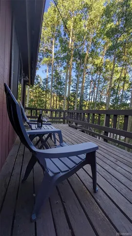 a wooden bench sitting on top of a wooden deck