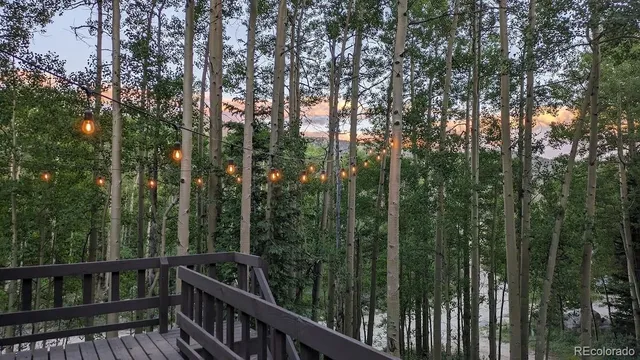 a view of a balcony with trees