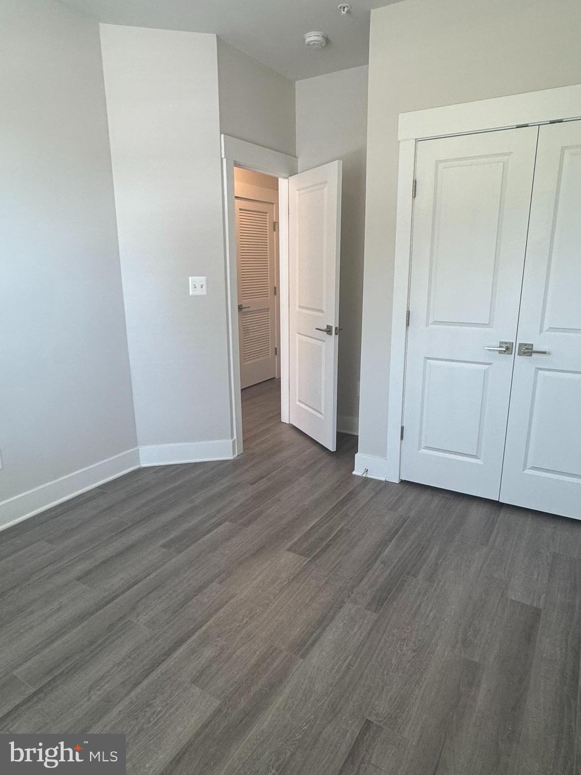 2921 Osprey Way Frederick, MD 21701 - Photo 11 of 27 a view of an empty room with wooden floor
