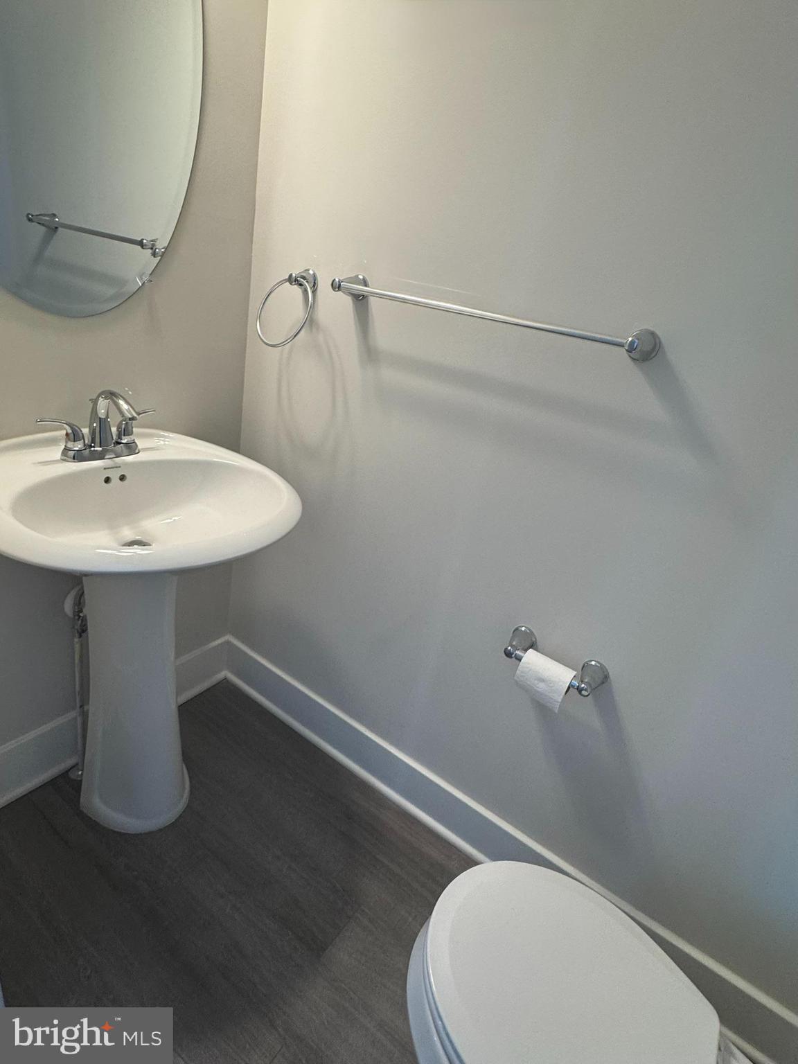 2921 Osprey Way Frederick, MD 21701 - Photo 12 of 27 a white toilet sitting next to a bathroom sink
