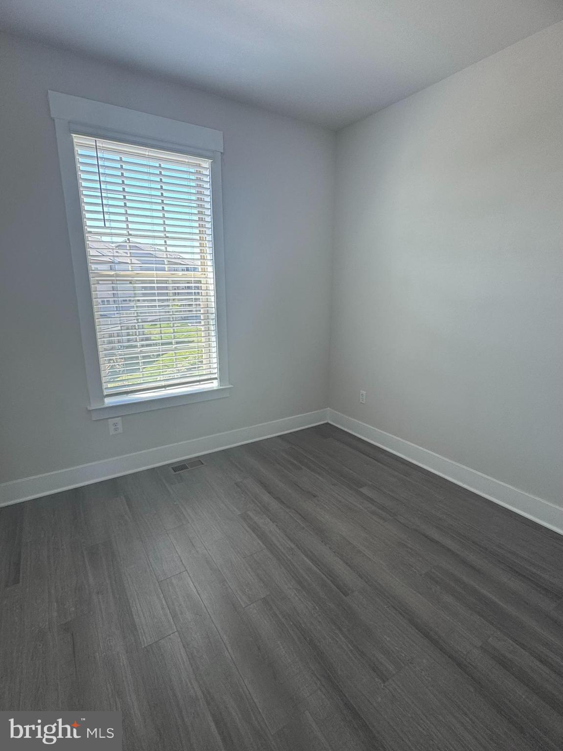 2921 Osprey Way Frederick, MD 21701 - Photo 17 of 27 an empty room with wooden floor and windows