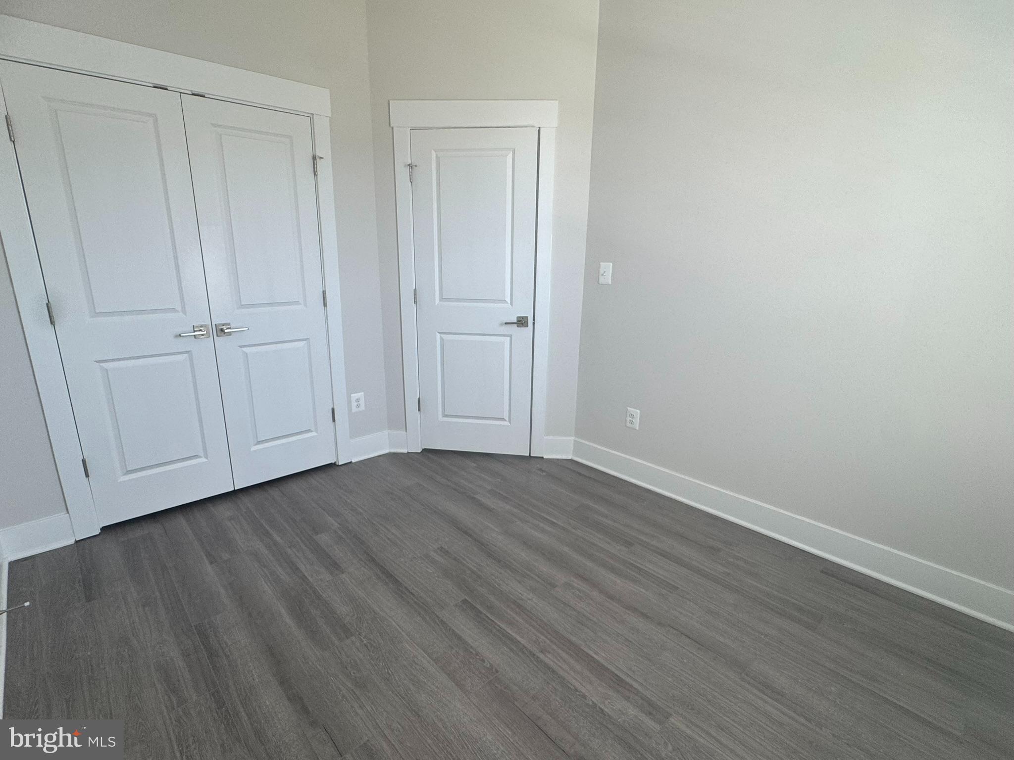 2921 Osprey Way Frederick, MD 21701 - Photo 18 of 27 a view of an empty room with wooden floor