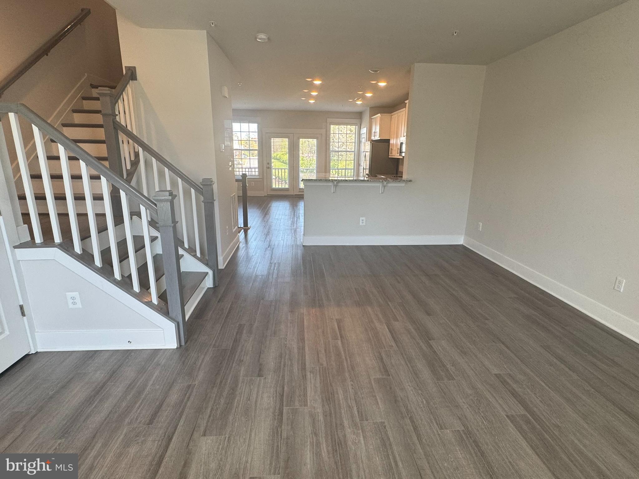 2921 Osprey Way Frederick, MD 21701 - Photo 6 of 27 a view of a hallway with wooden floor and staircase
