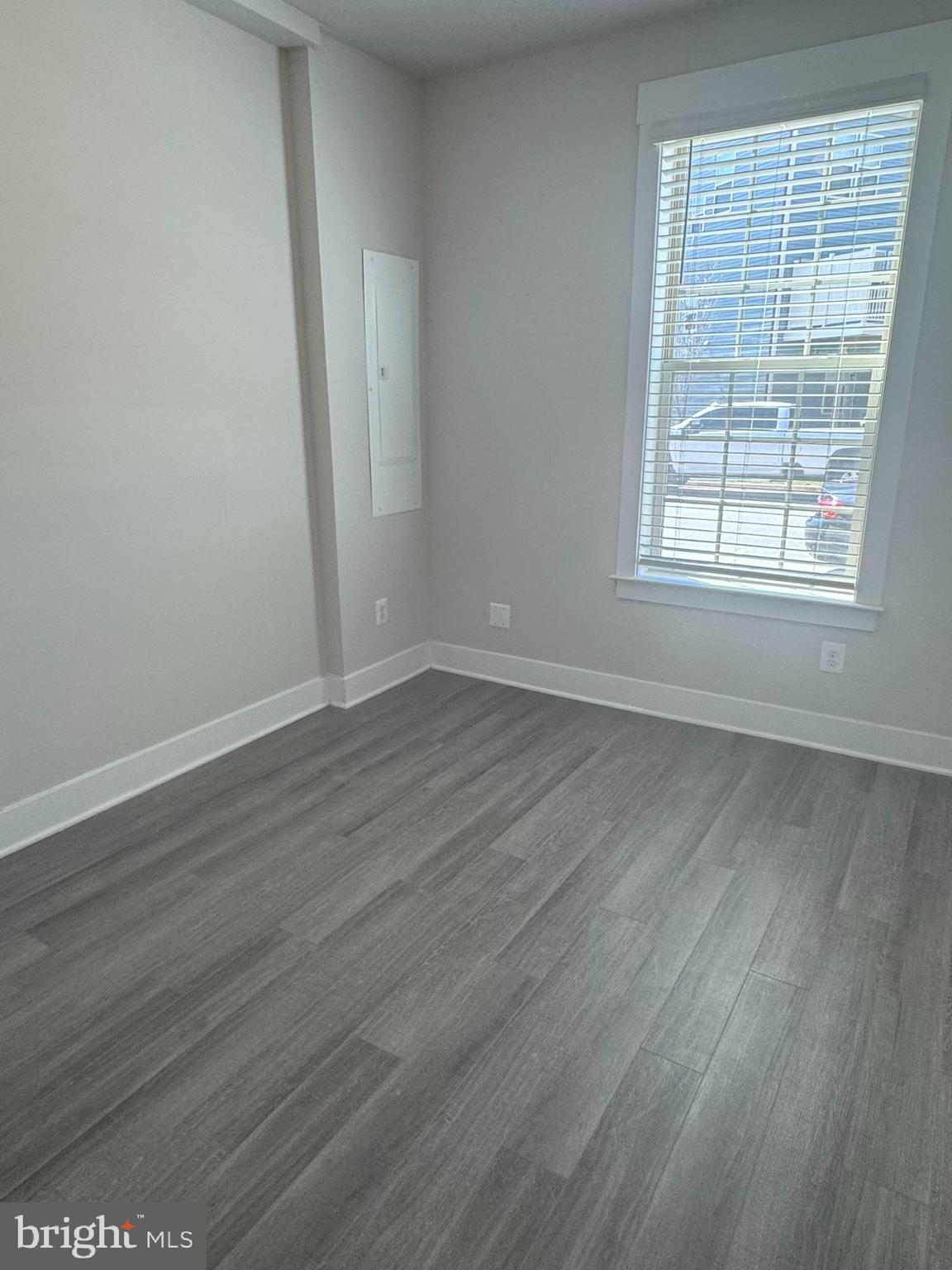2921 Osprey Way Frederick, MD 21701 - Photo 10 of 27 an empty room with wooden floor and windows