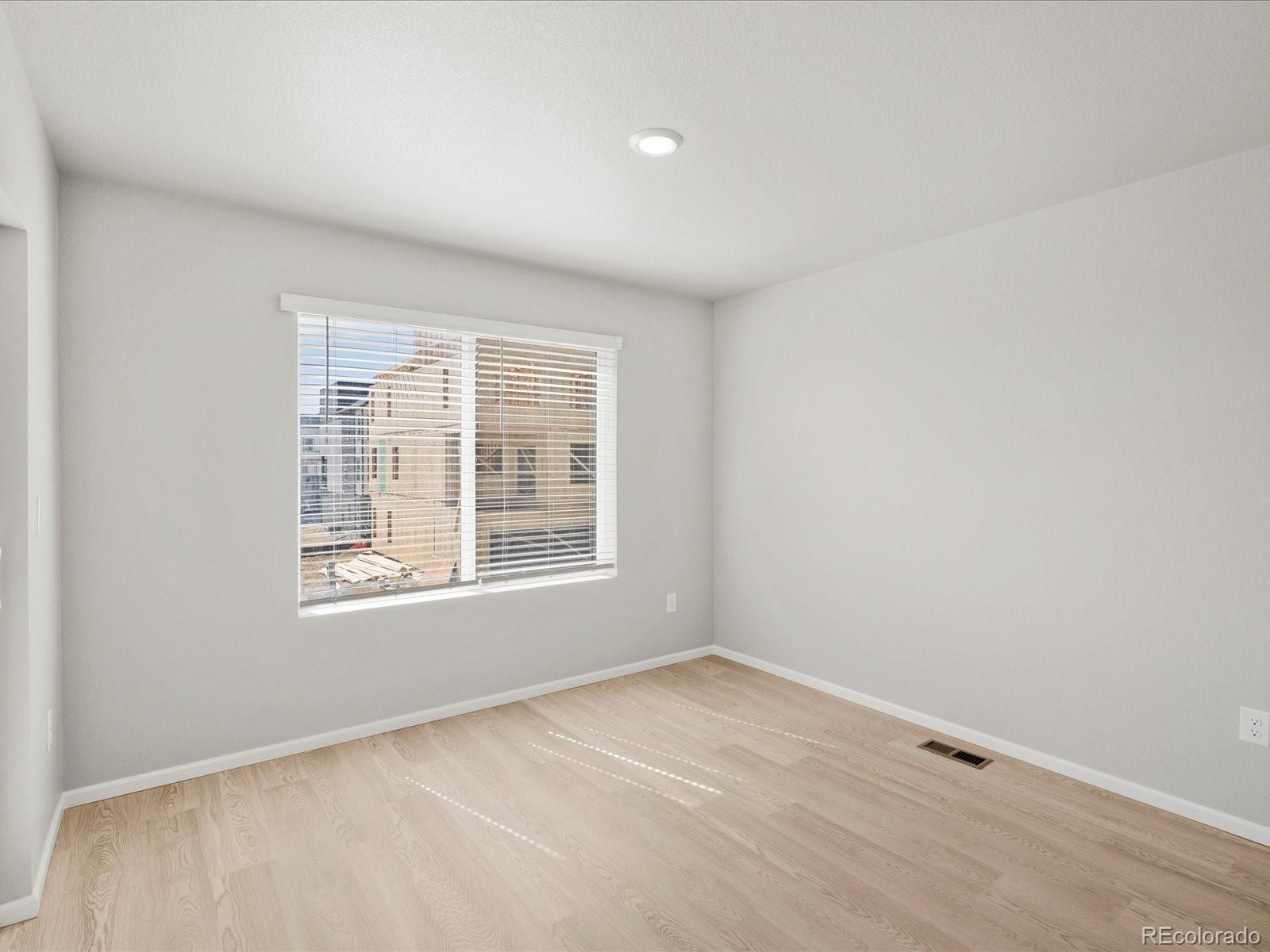 14451 Pansy Loop Morrison, CO 80465 - Photo 12 of 34 an empty room with a window