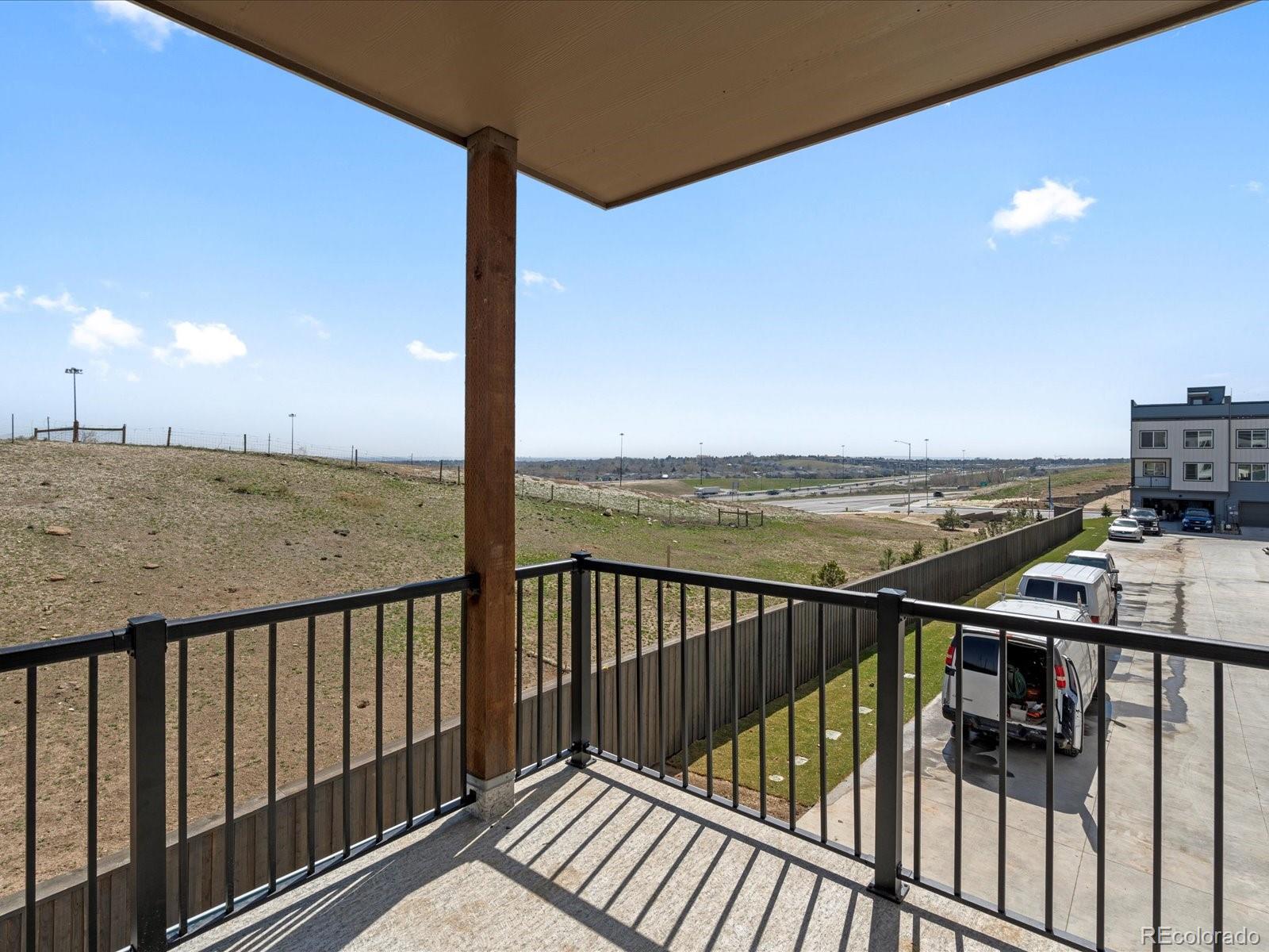 14451 Pansy Loop Morrison, CO 80465 - Photo 13 of 34 a view of a balcony with an ocean view