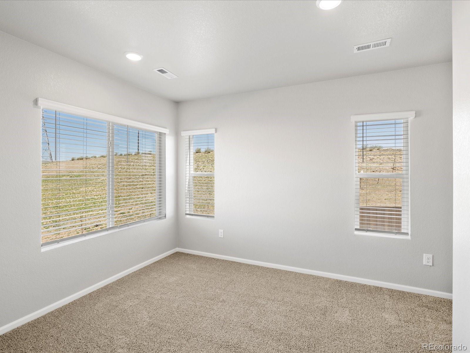 14451 Pansy Loop Morrison, CO 80465 - Photo 15 of 34 a view of an empty room with a window
