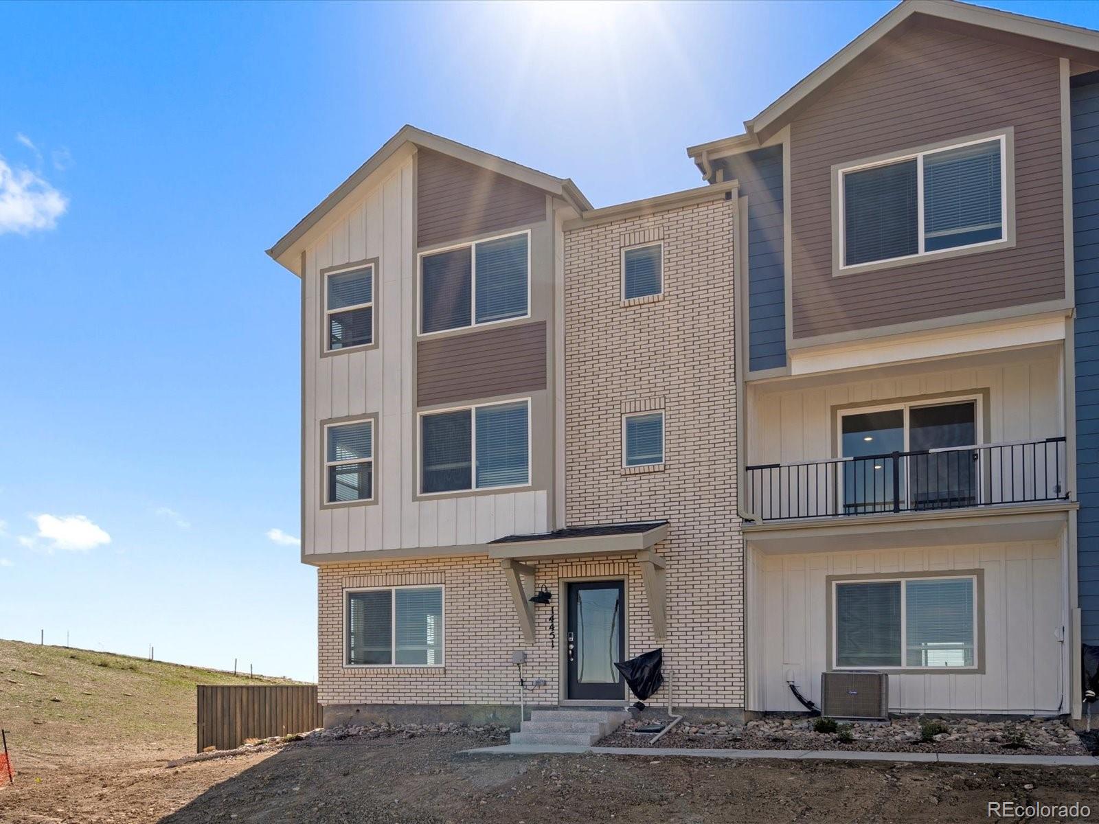 14451 Pansy Loop Morrison, CO 80465 - Photo 2 of 34 a front view of a house with a yard