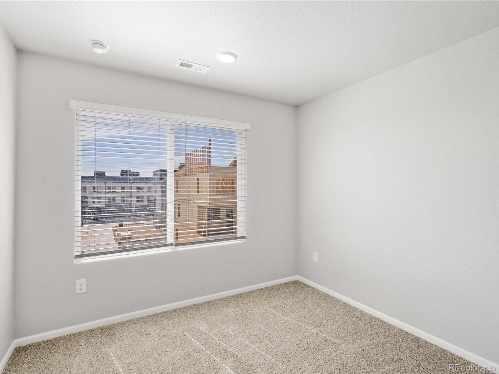 14451 Pansy Loop Morrison, CO 80465 - Photo 27 of 34 a view of an empty room with a window