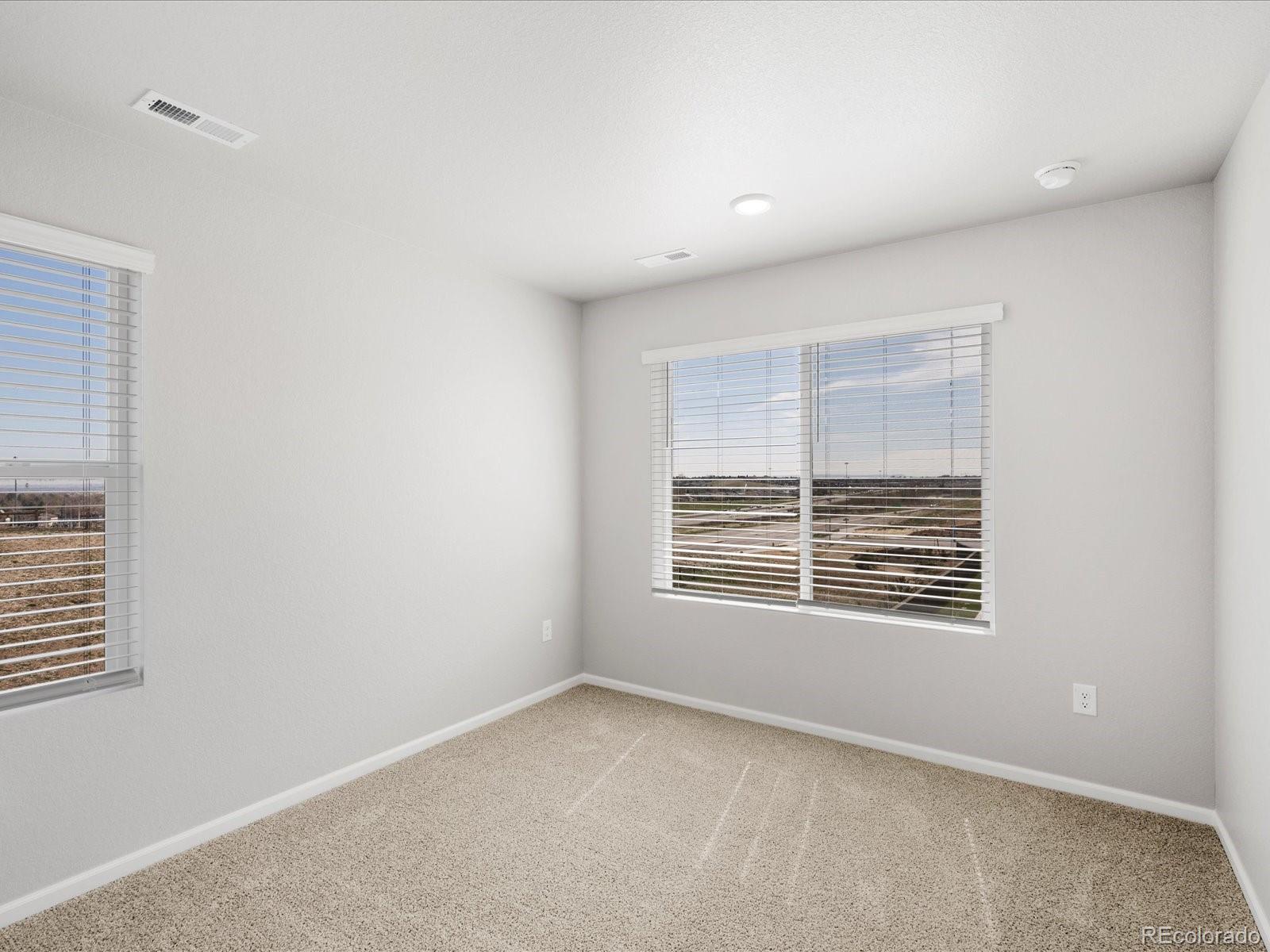 14451 Pansy Loop Morrison, CO 80465 - Photo 29 of 34 a view of an empty room with a window