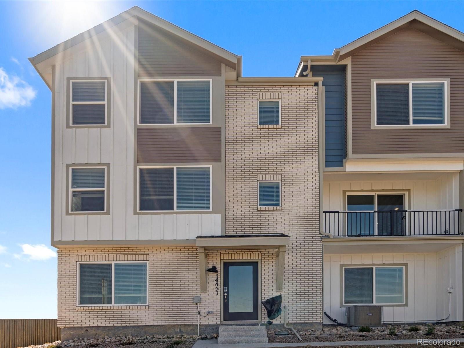 14451 Pansy Loop Morrison, CO 80465 - Photo 3 of 34 a front view of a house