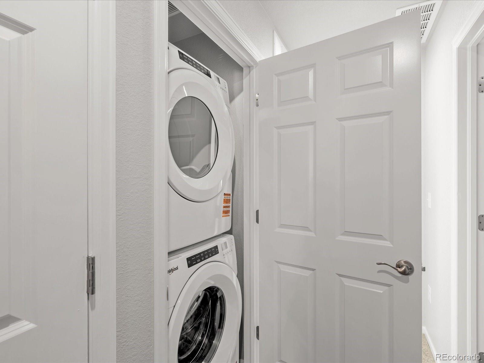 14451 Pansy Loop Morrison, CO 80465 - Photo 31 of 34 a utility room with dryer and washer