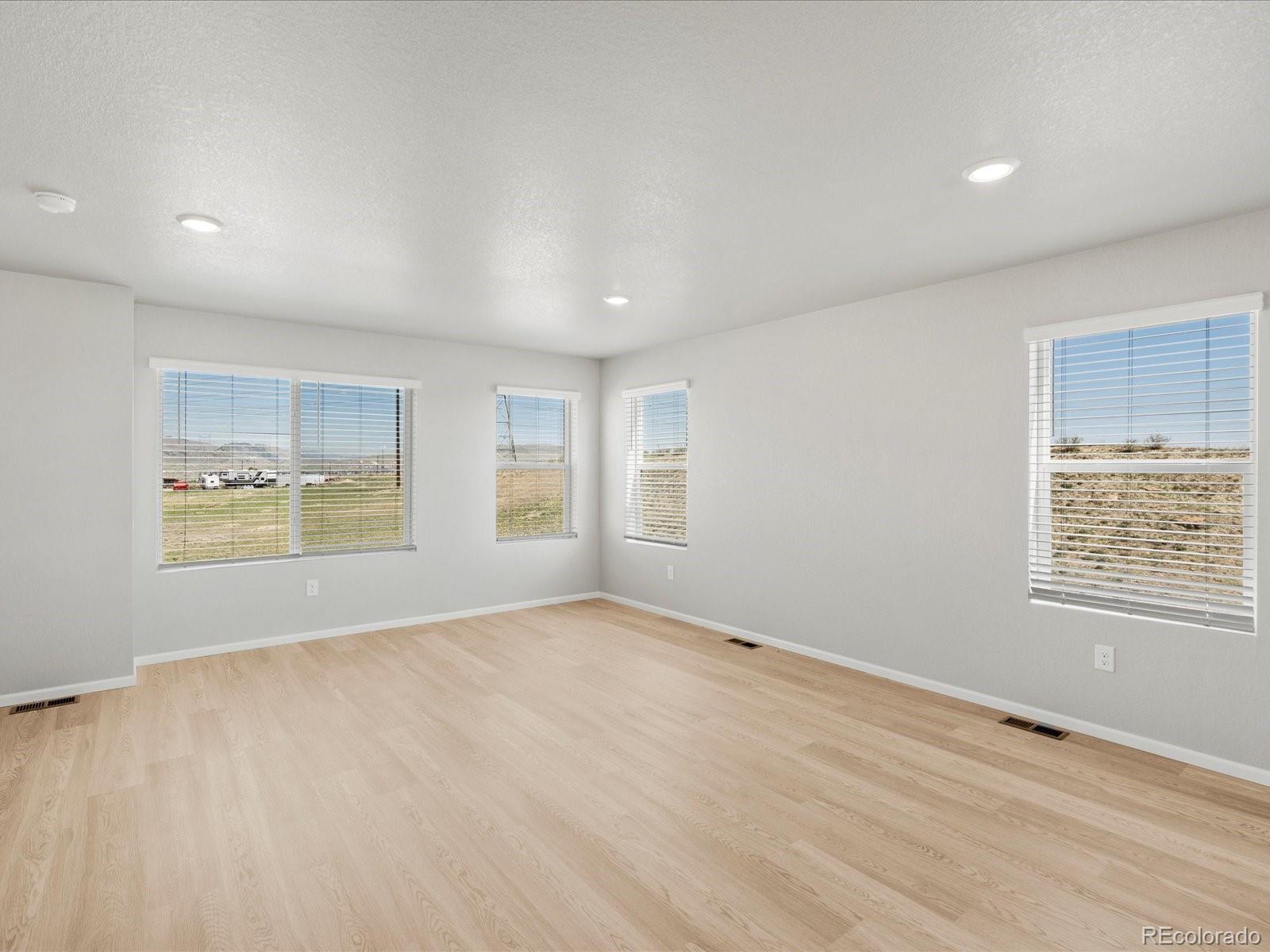 14451 Pansy Loop Morrison, CO 80465 - Photo 9 of 34 a view of an empty room with a window
