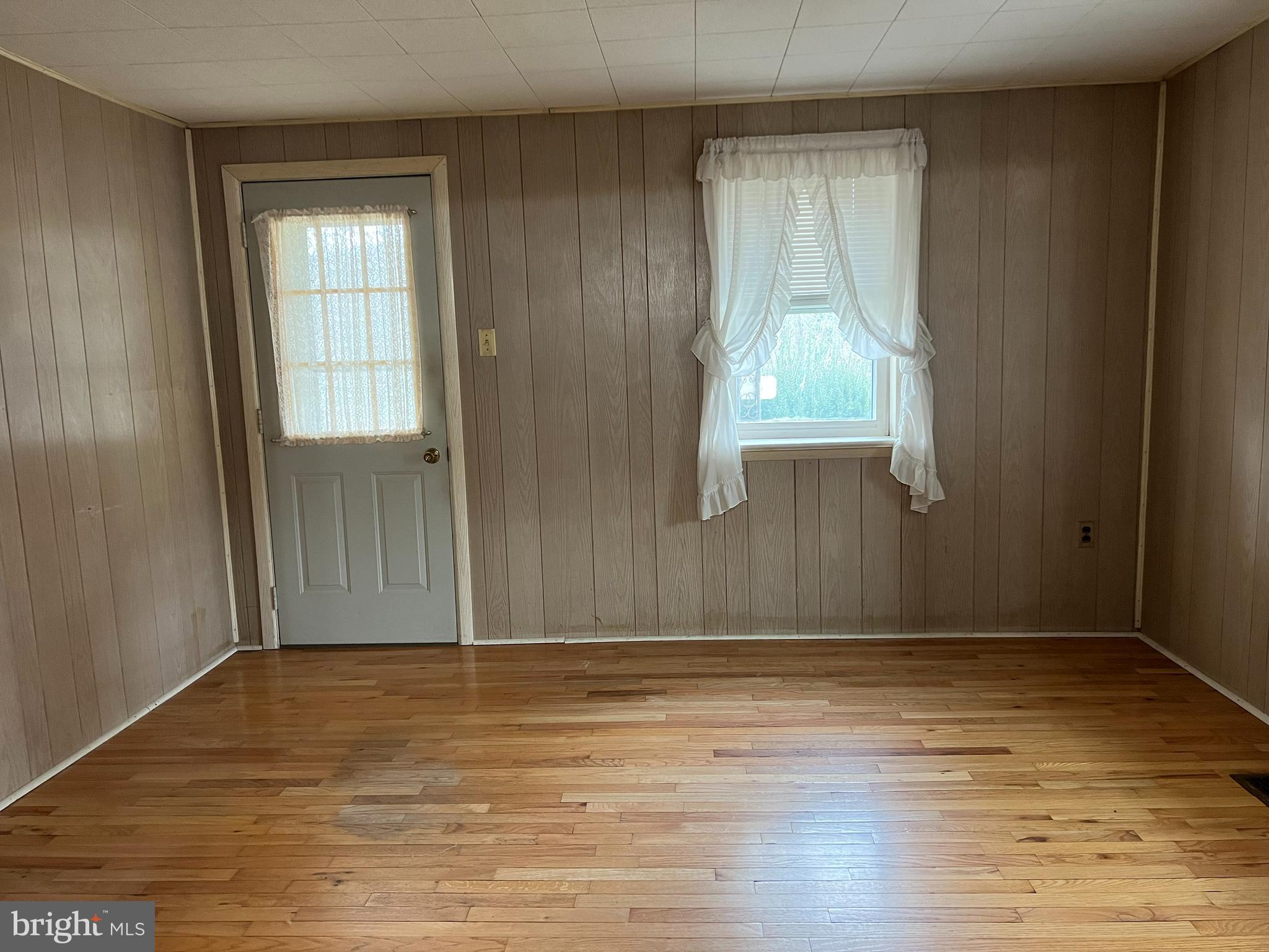 25447 Cascade Road Cascade, MD 21719 - Photo 11 of 22 a view of an empty room with wooden floor and a window