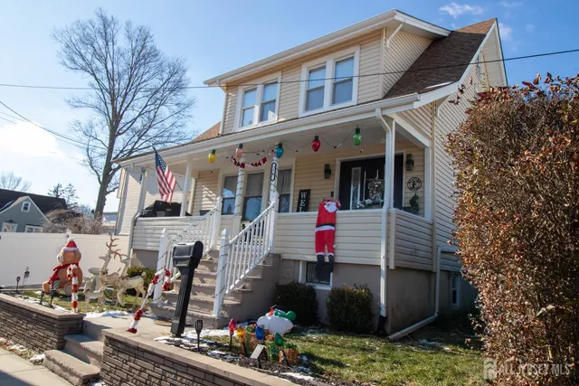 a front view of a building with an outdoor seating