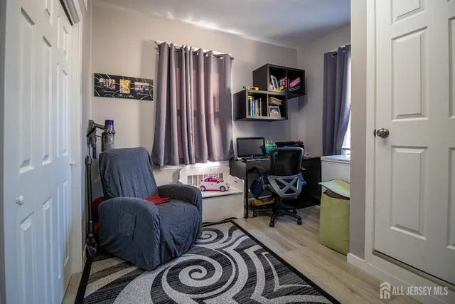 a bed room with a bed and a chair