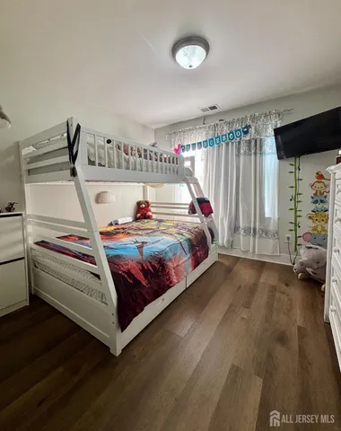 a bedroom with a bed and a walk in closet