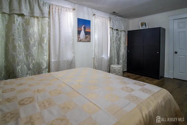 a bedroom with a bed and a view of bathroom