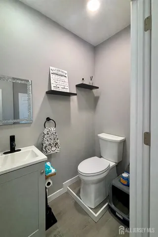 a bathroom with a toilet and a sink