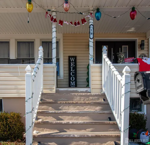 a front view of a house with a porch