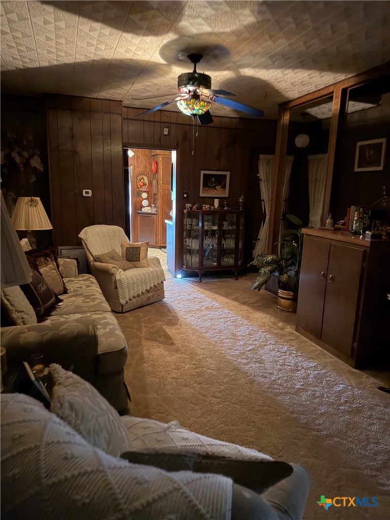 57 John Tillery Road Port Lavaca, TX 77979 - Photo 32 of 34 a living room with furniture and a ceiling fan