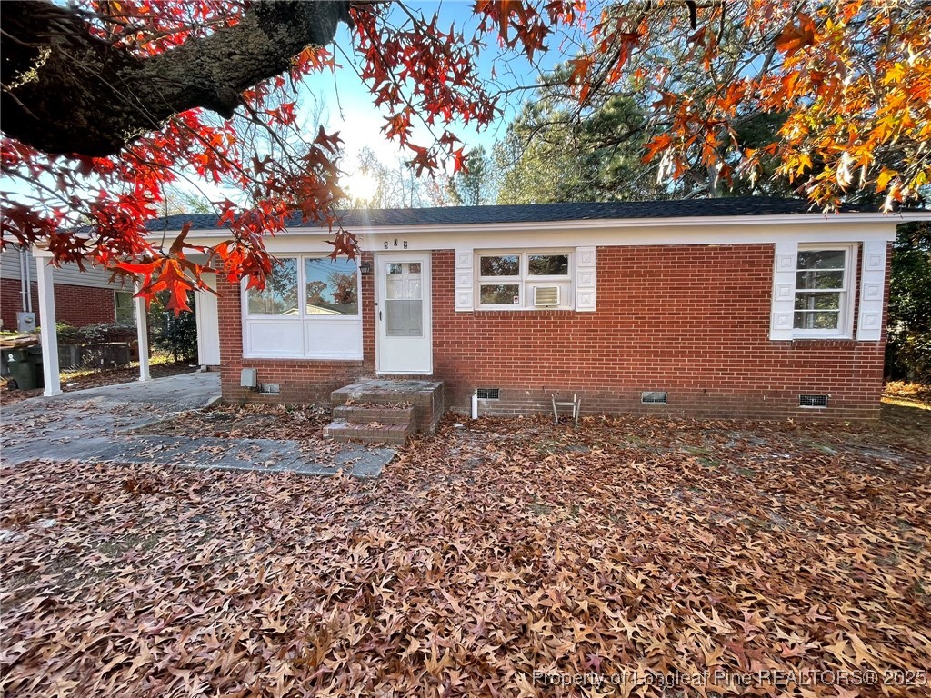 502 Spring Avenue Spring Lake, NC 28390 - Photo 1 of 20 front view of a house with a tree