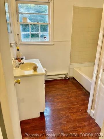 a bathroom with a sink and a window