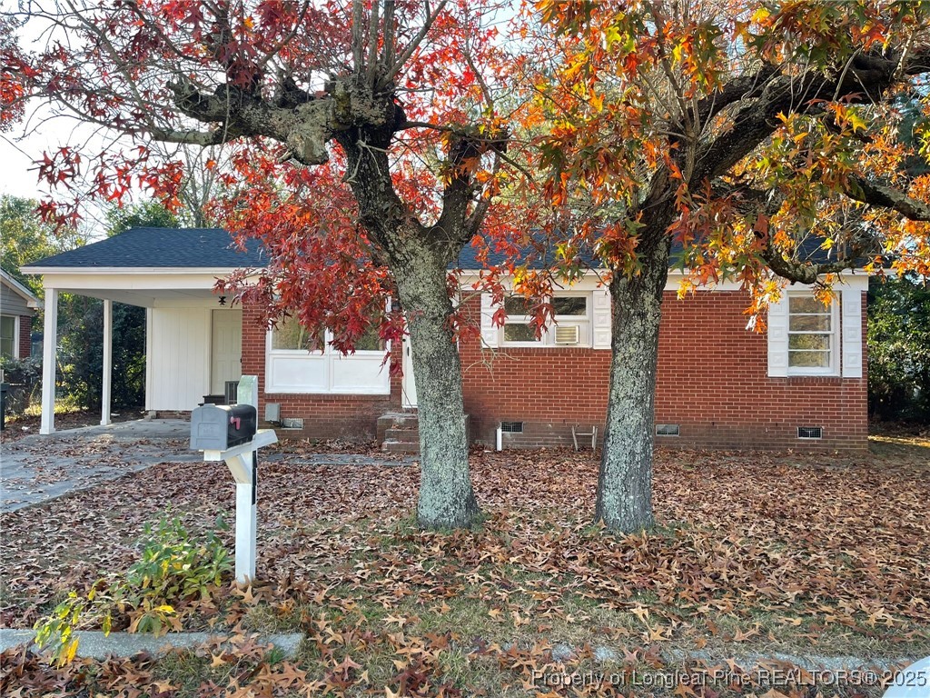 502 Spring Avenue Spring Lake, NC 28390 - Photo 17 of 20 a front view of a house with a tree