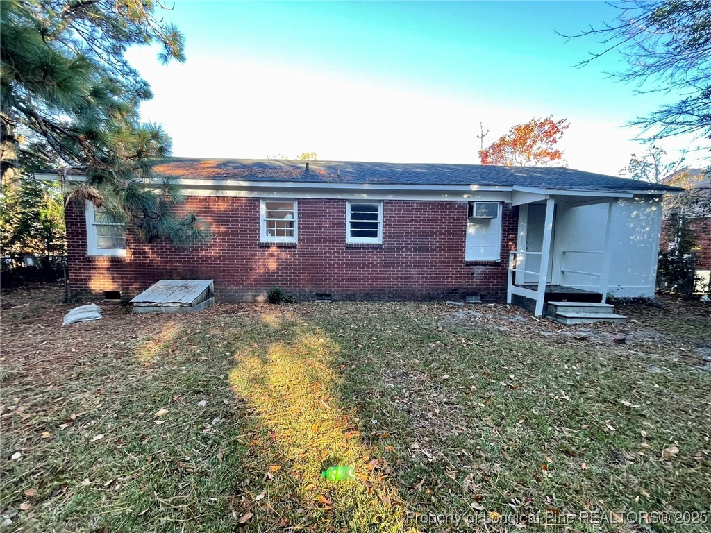 502 Spring Avenue Spring Lake, NC 28390 - Photo 18 of 20 a view of a backyard with potted plants and large tree