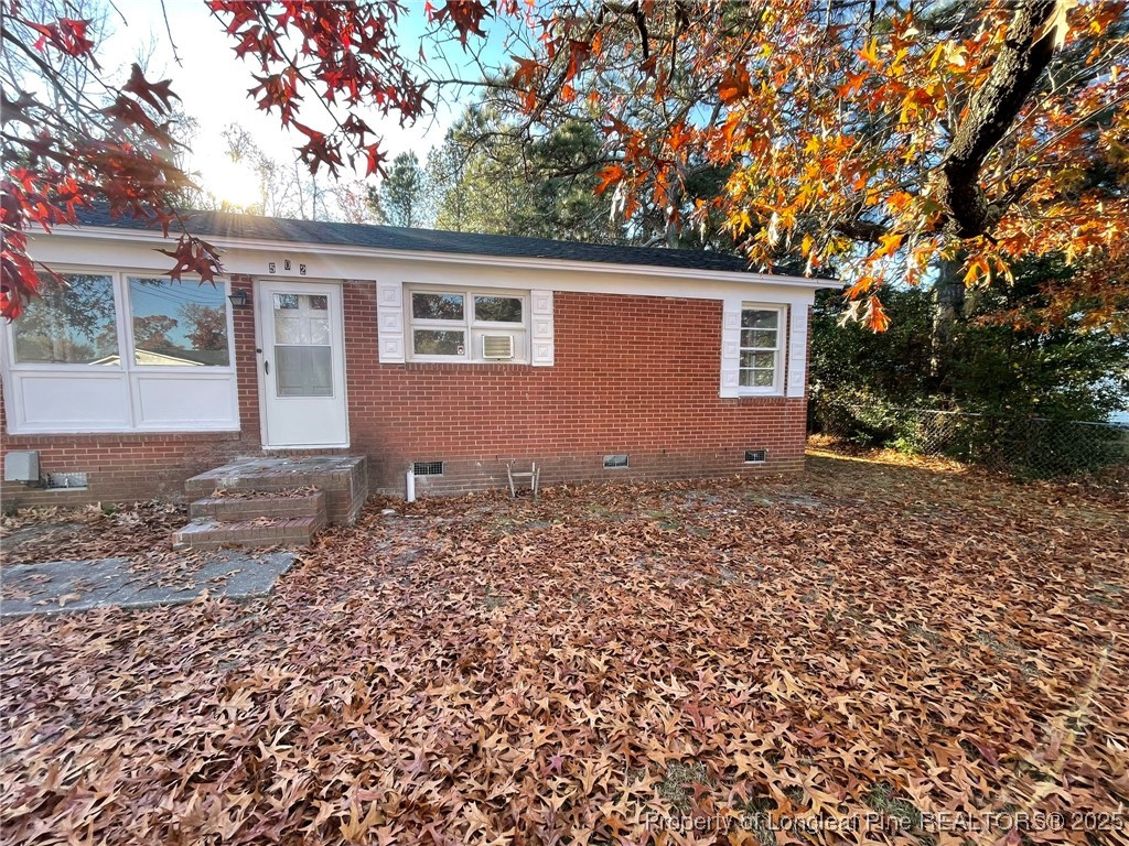 502 Spring Avenue Spring Lake, NC 28390 - Photo 4 of 20 front view of house with a trees