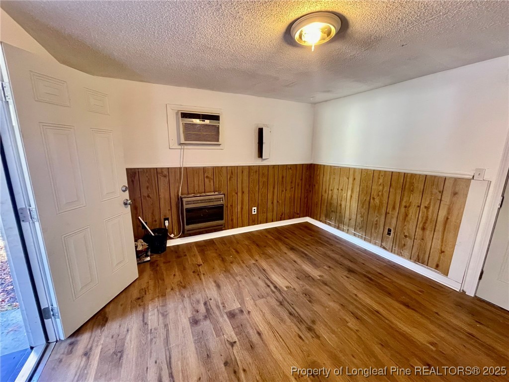 502 Spring Avenue Spring Lake, NC 28390 - Photo 6 of 20 a view of empty room with wooden floor and fan
