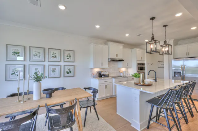 a utility room with sink dryer and washer