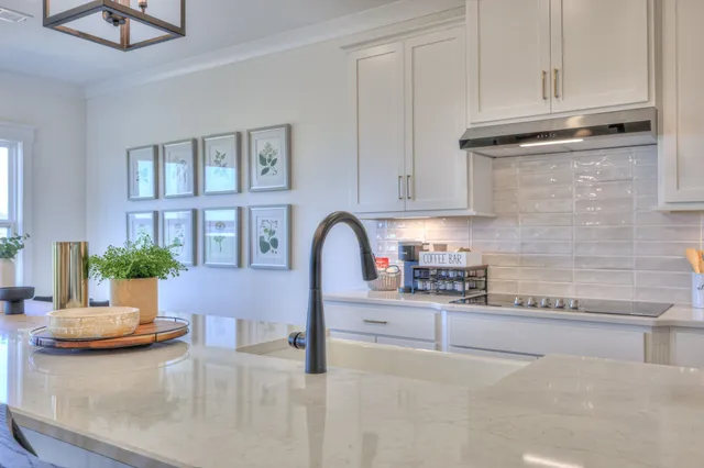 a spacious bathroom with a granite countertop sink mirror and double