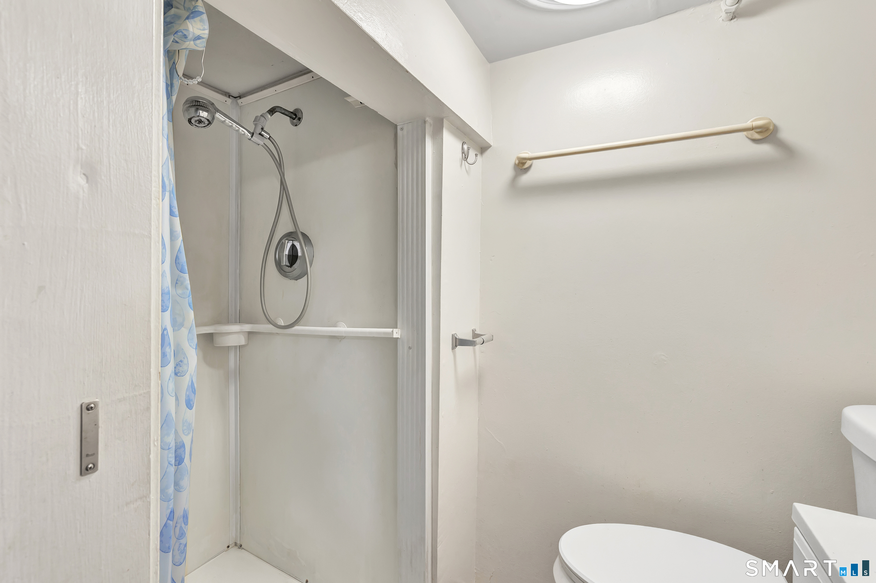 123 River Road Shelton, CT 06484 - Photo 19 of 27 a bathroom with a granite countertop shower and a toilet