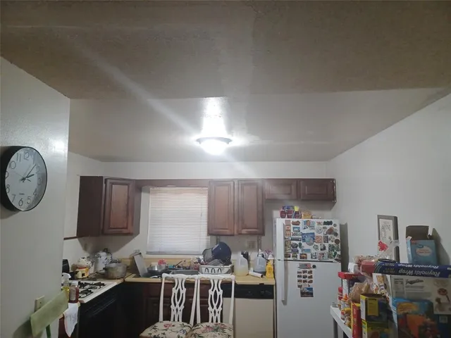 a bathroom with a sink and mirror with toilet
